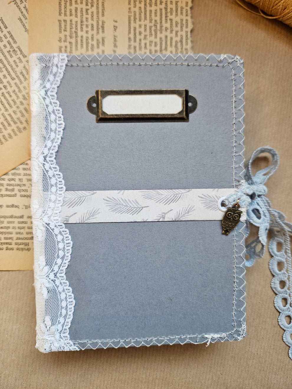Handmade booklet with lace & a charm
