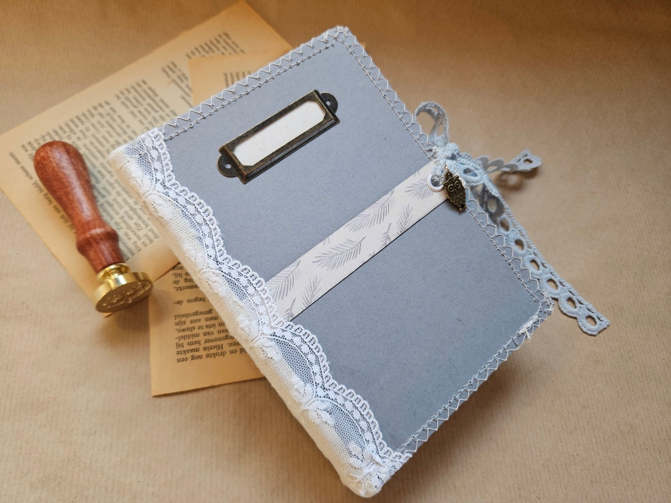 Handmade booklet with lace & a charm