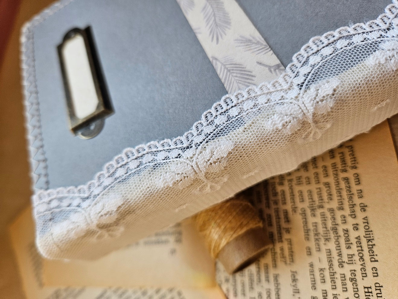 Handmade booklet with lace & a charm
