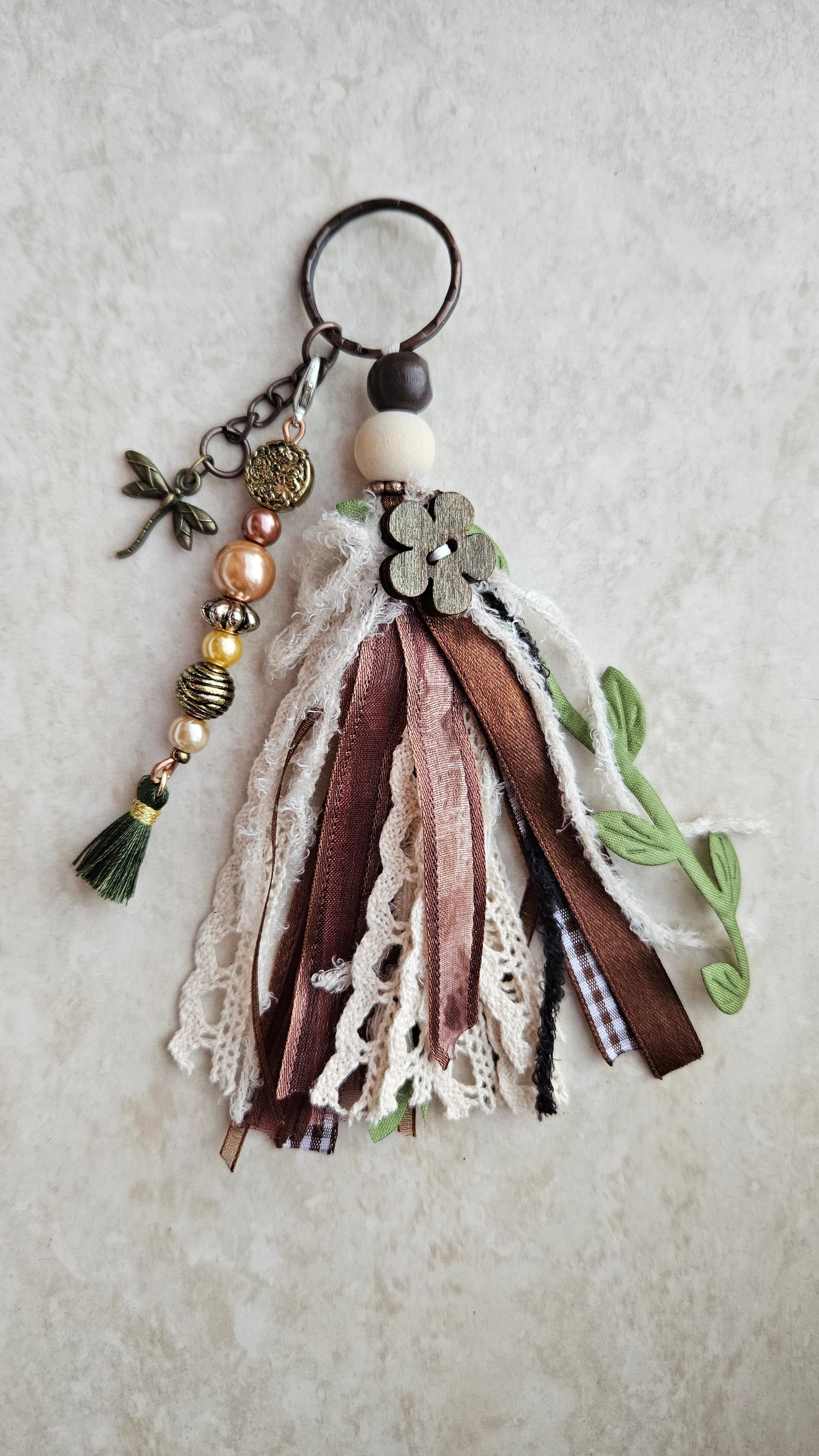 Charm with dragonfly pendant and ribbons