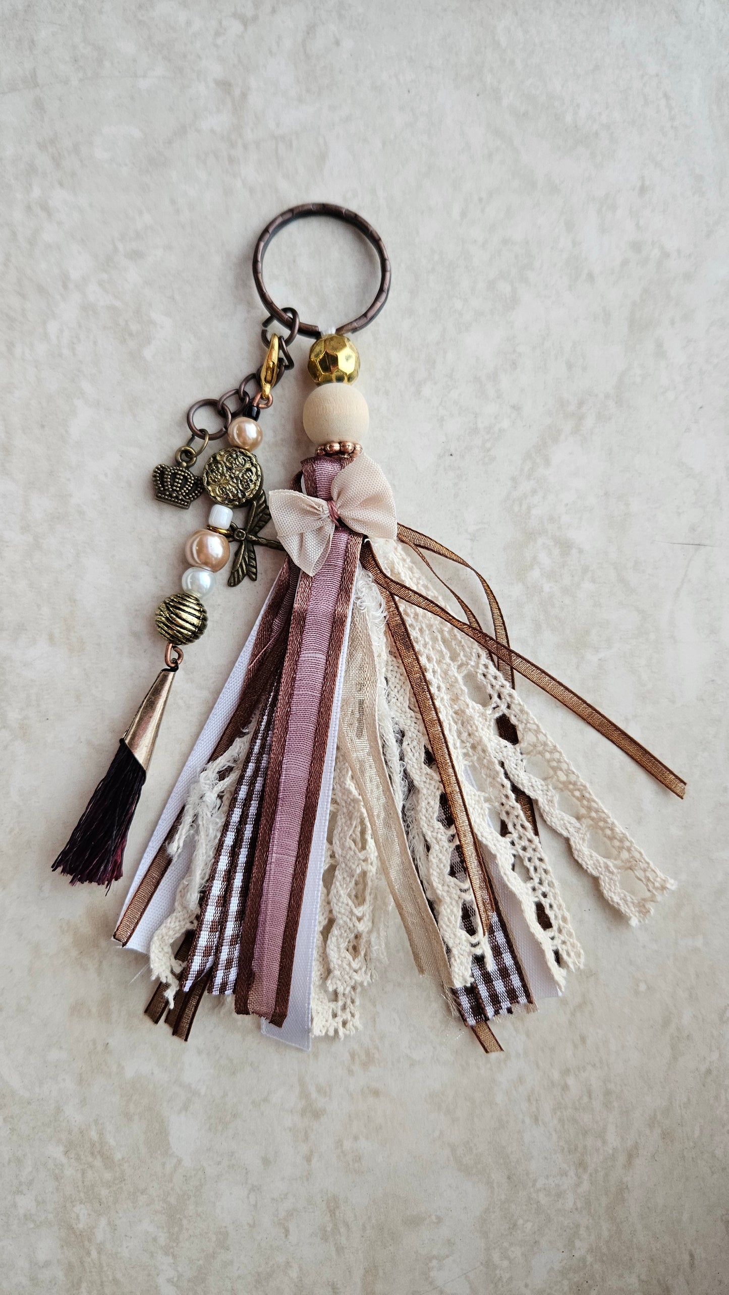 Charm with crown pendant and ribbons