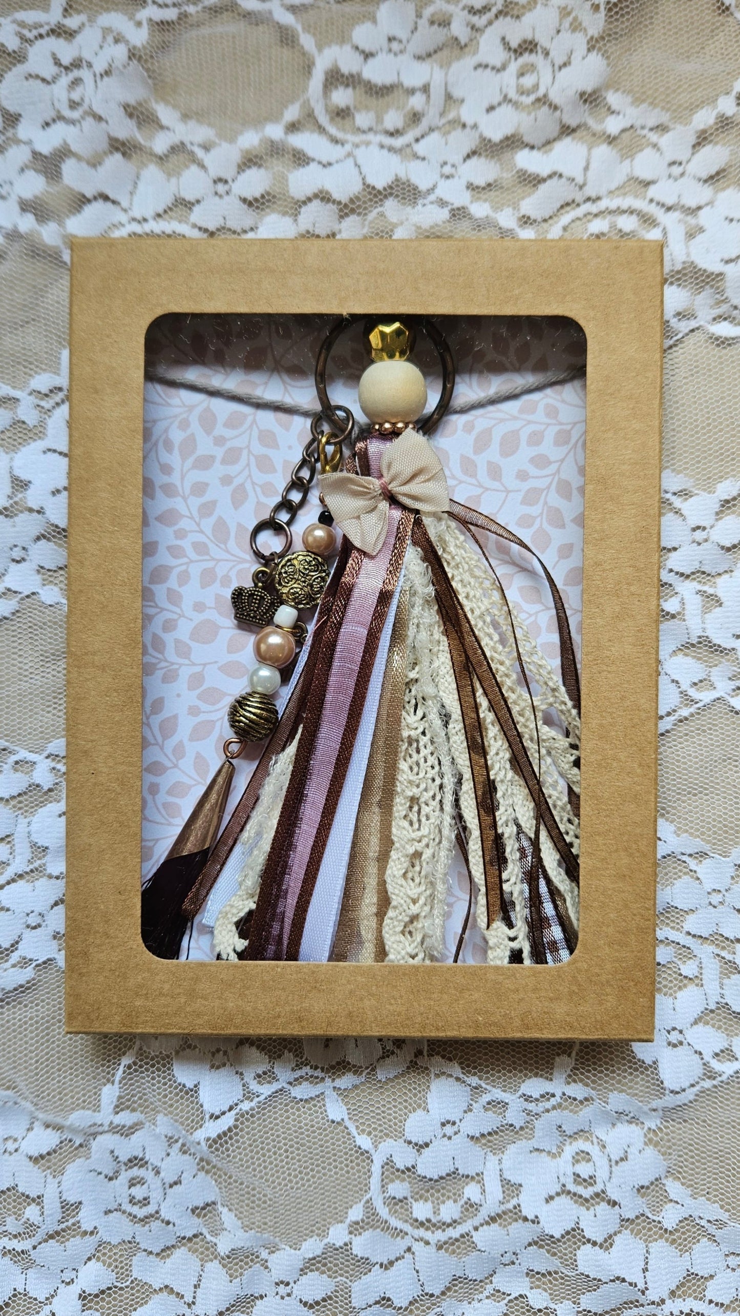 Charm with crown pendant and ribbons