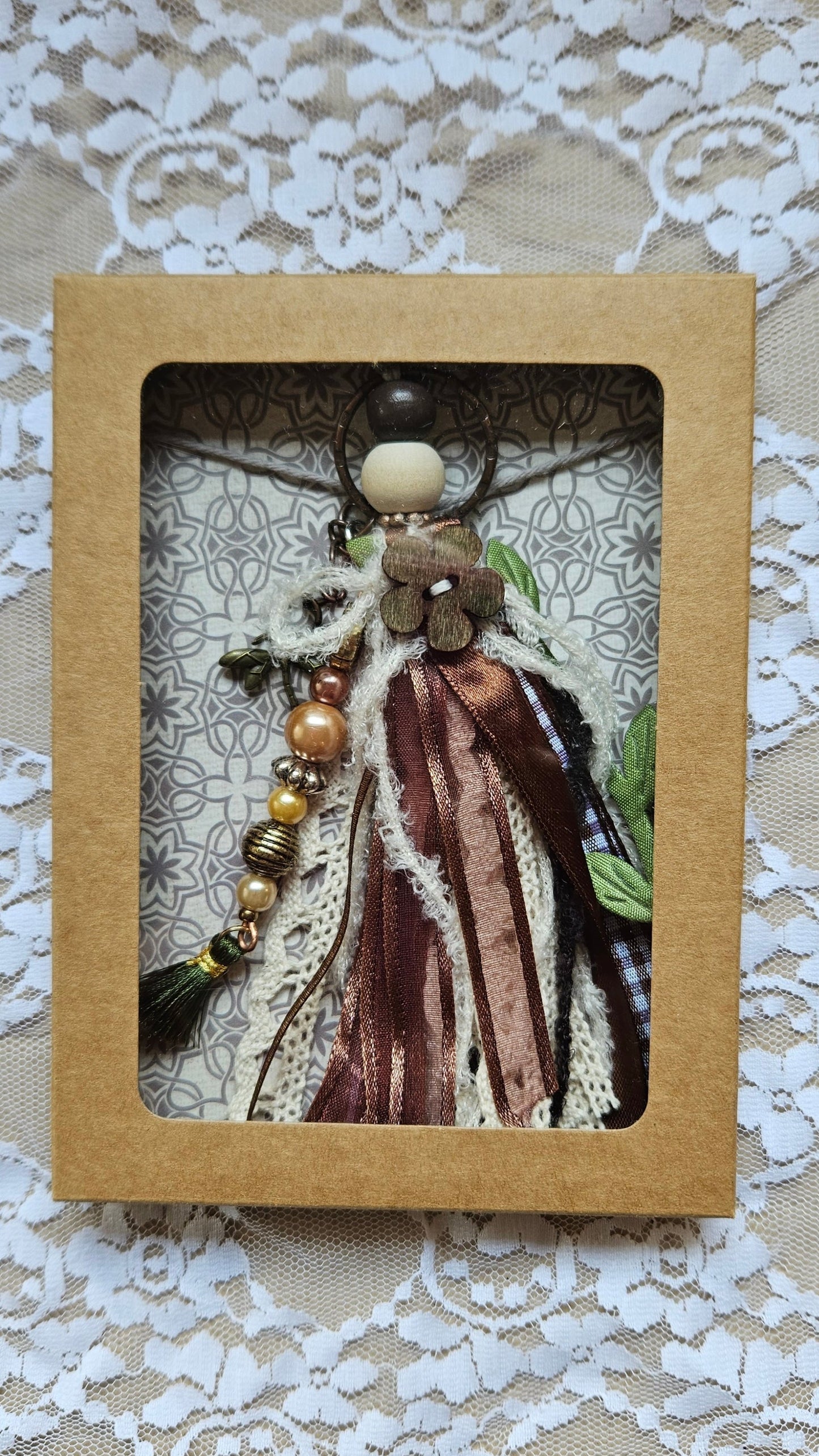 Charm with dragonfly pendant and ribbons