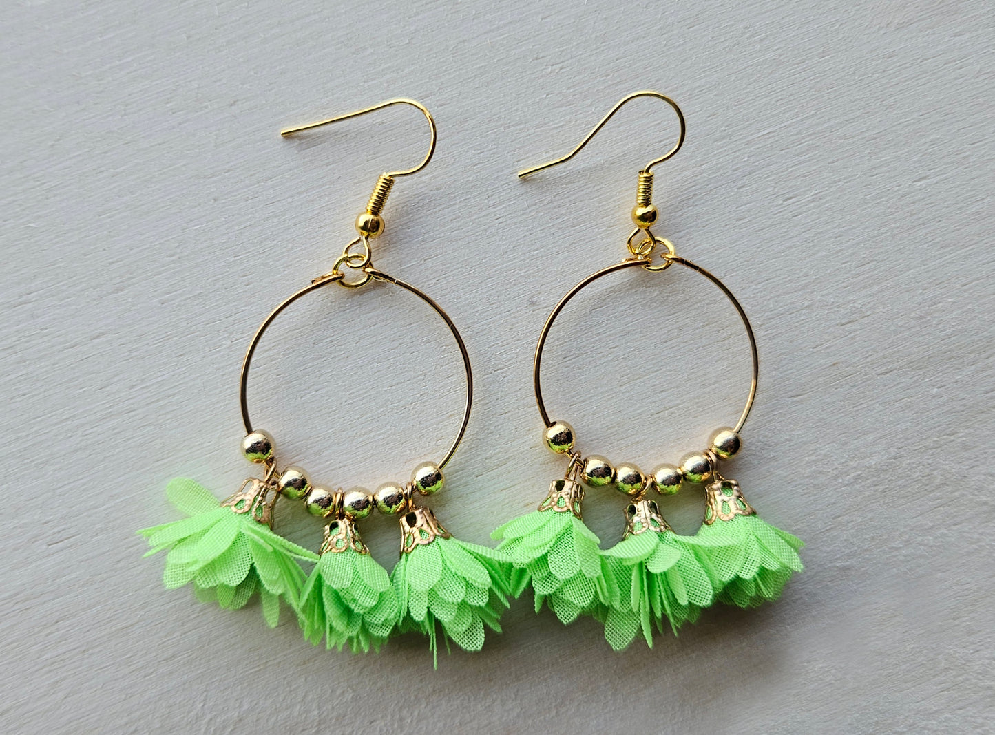Gold hoop earrings with flowers