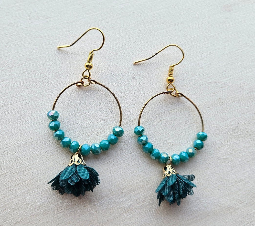 Gold hoop earrings with flower