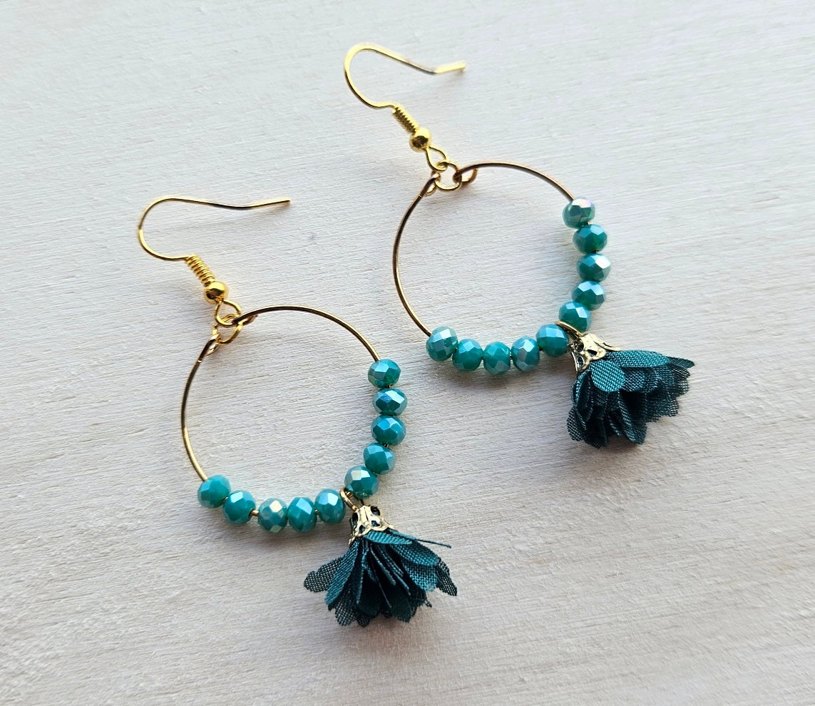 Gold hoop earrings with flower