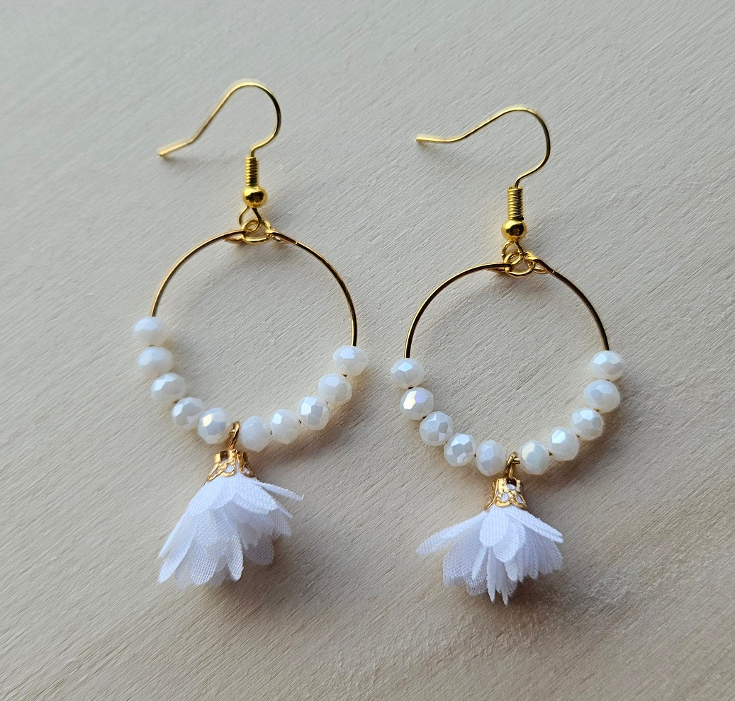 Gold hoop earrings with white flower