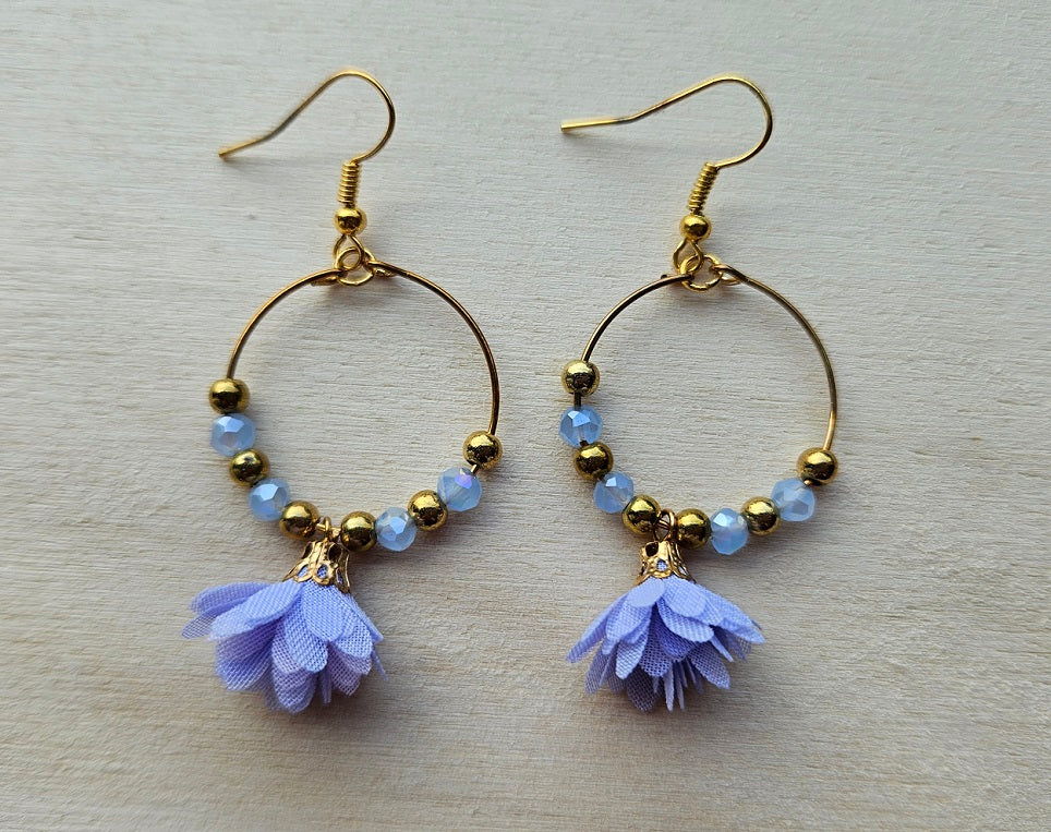 Gold hoop earrings with flower