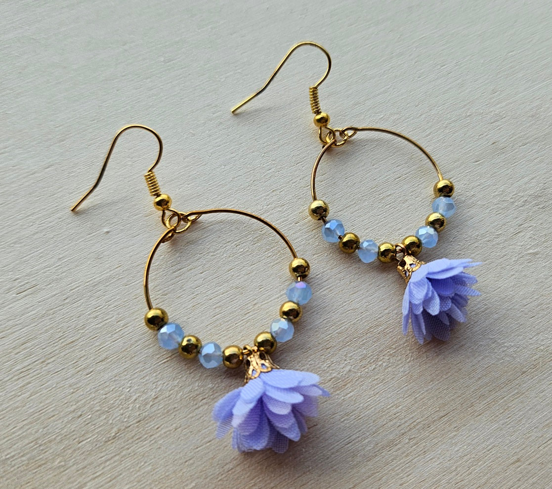 Gold hoop earrings with flower
