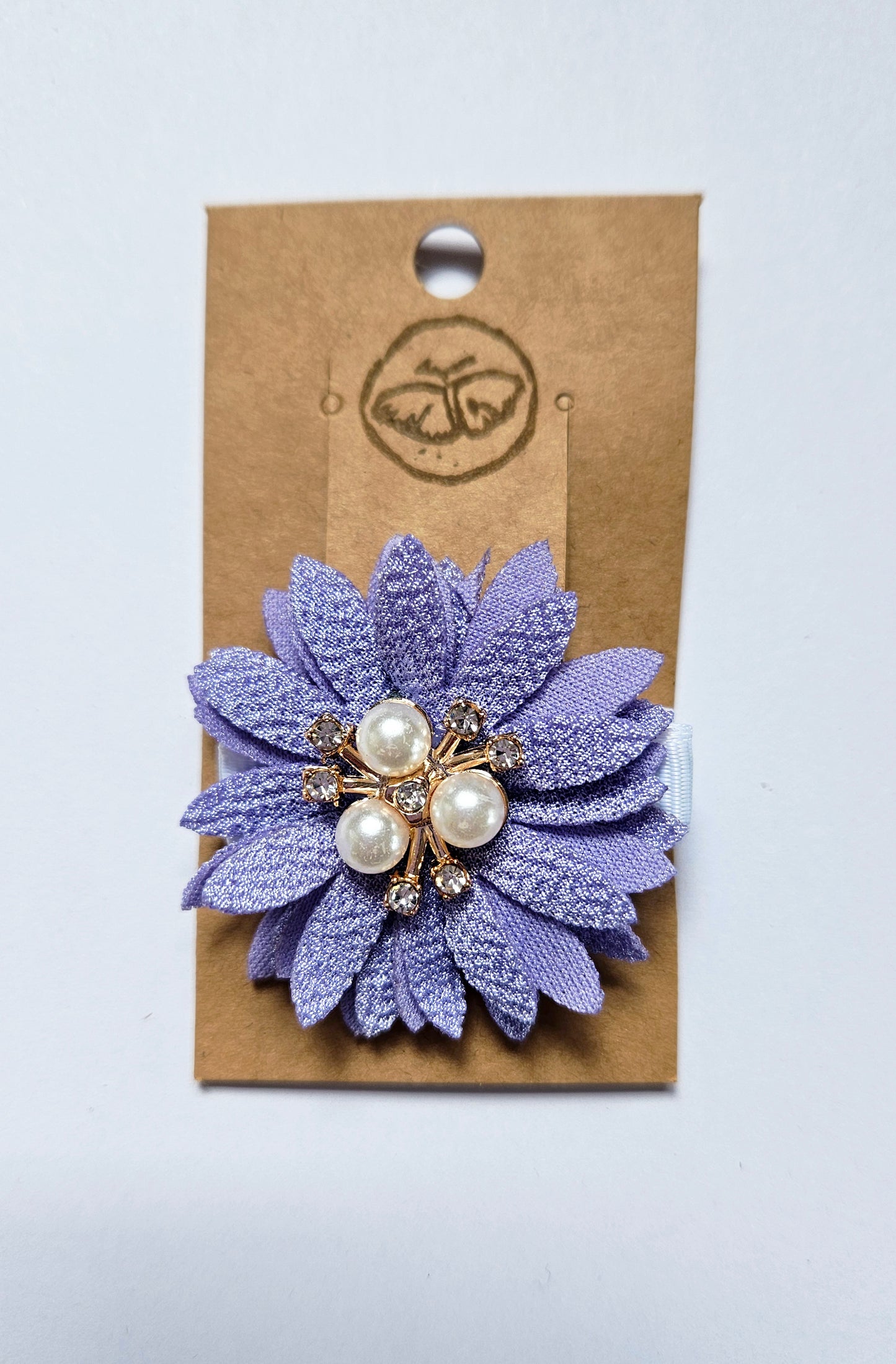 Hairclip with purple flower and rhinestone pearls