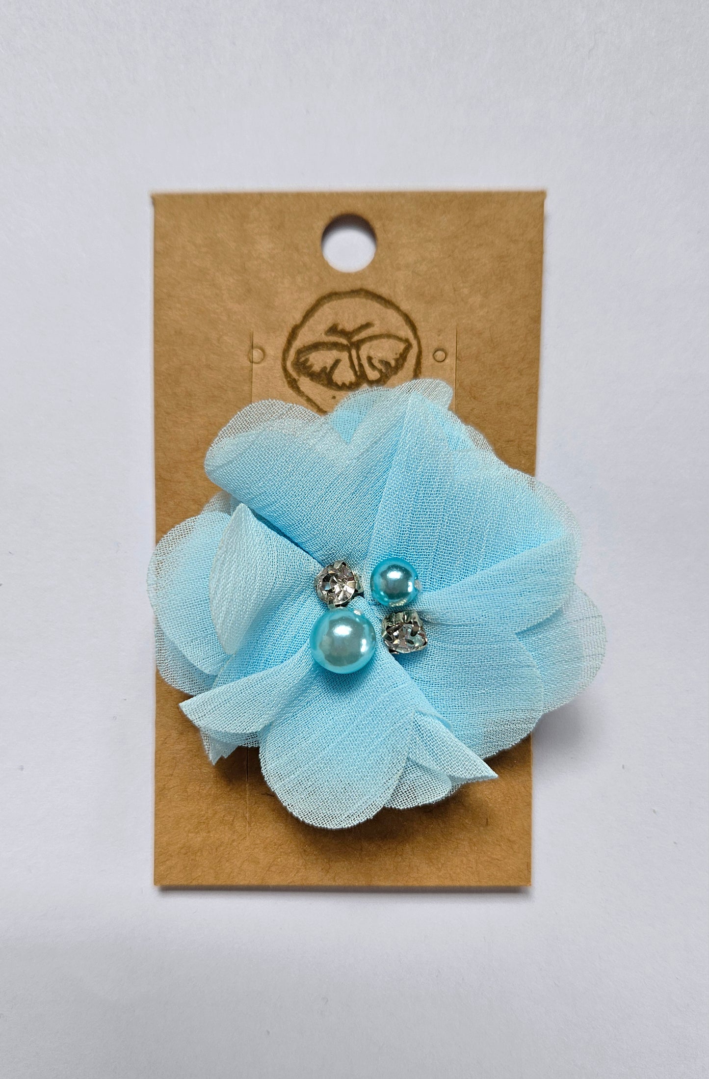 Hairclip with blue flower and rhinestone pearls