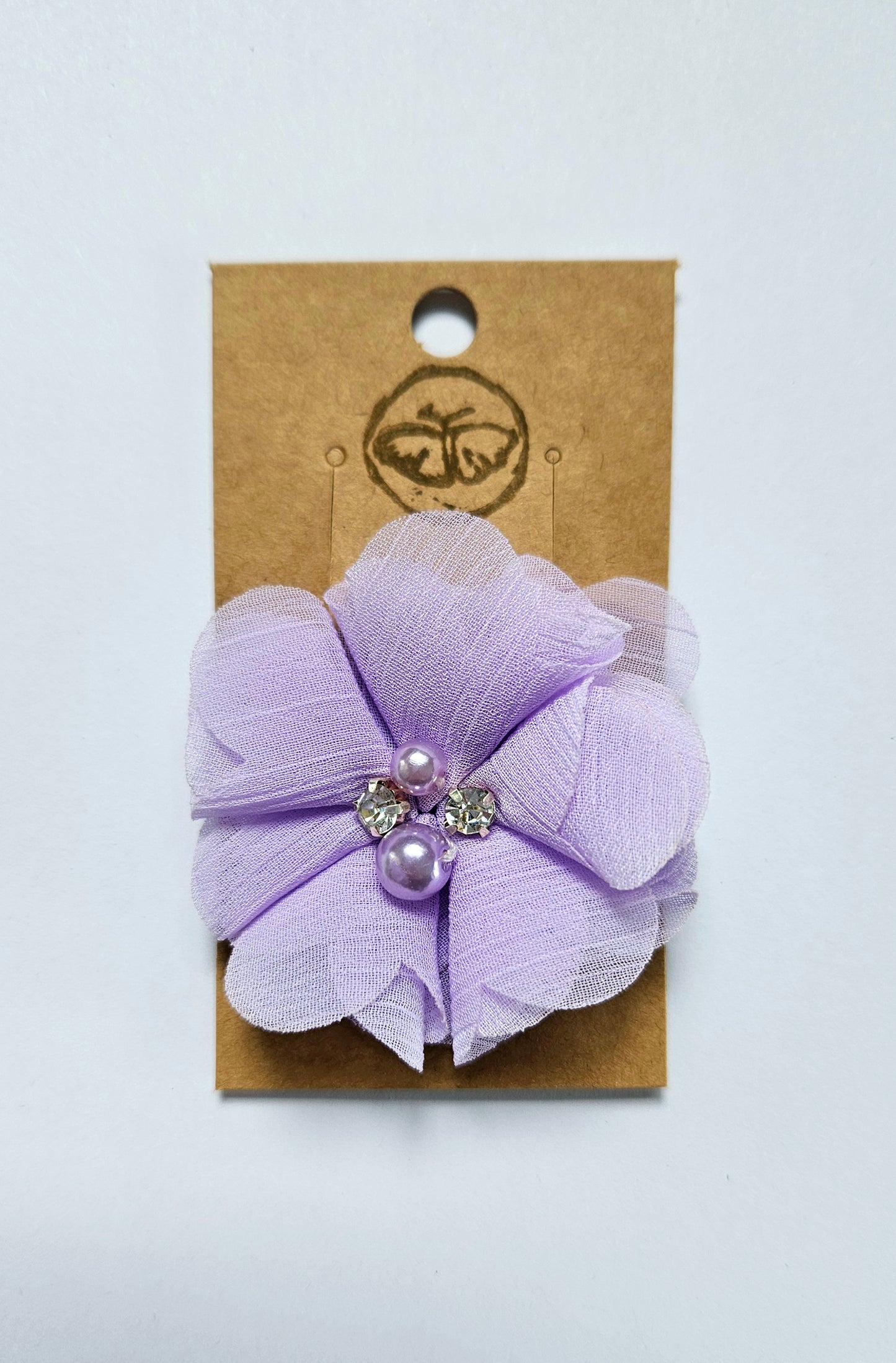 Hairclip with purple flower and rhinestone pearls